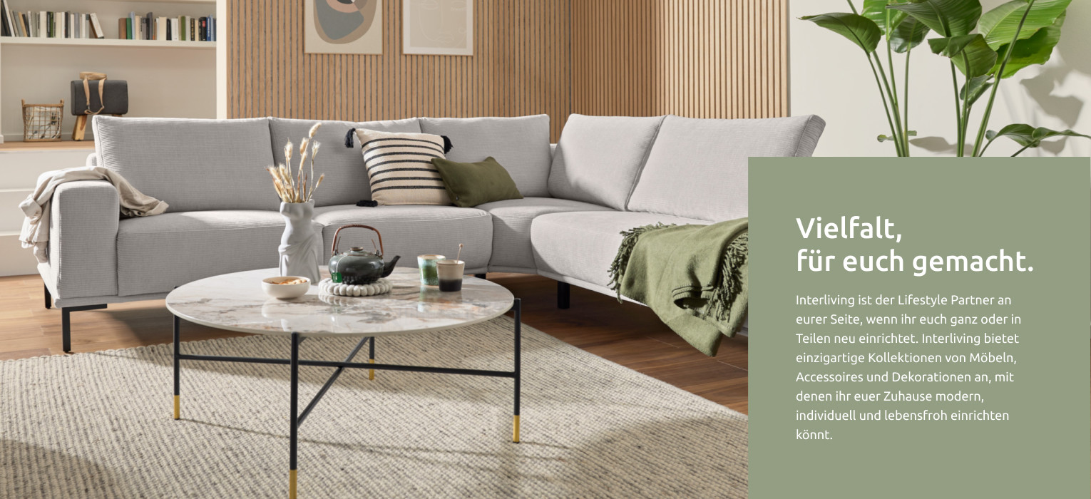 Modernes Wohnzimmer mit grauer Interliving Wohnlandschaft