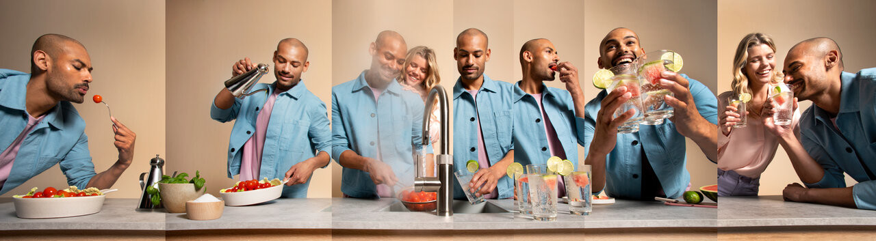 Ein Mann und eine Frau nutzen die vielseitigen Funktionen des Quooker Wasserhahns in der Küche